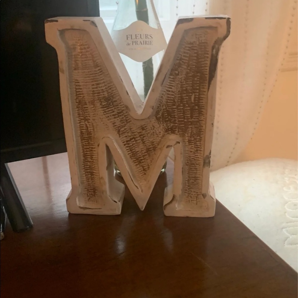 distressed “m” decoration